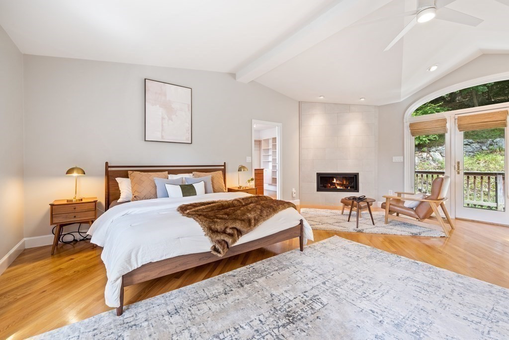 16 Marshall Road Winchester, MA 01890 - Photo 16 of 42 a bedroom with a bed a table and painting on the wall