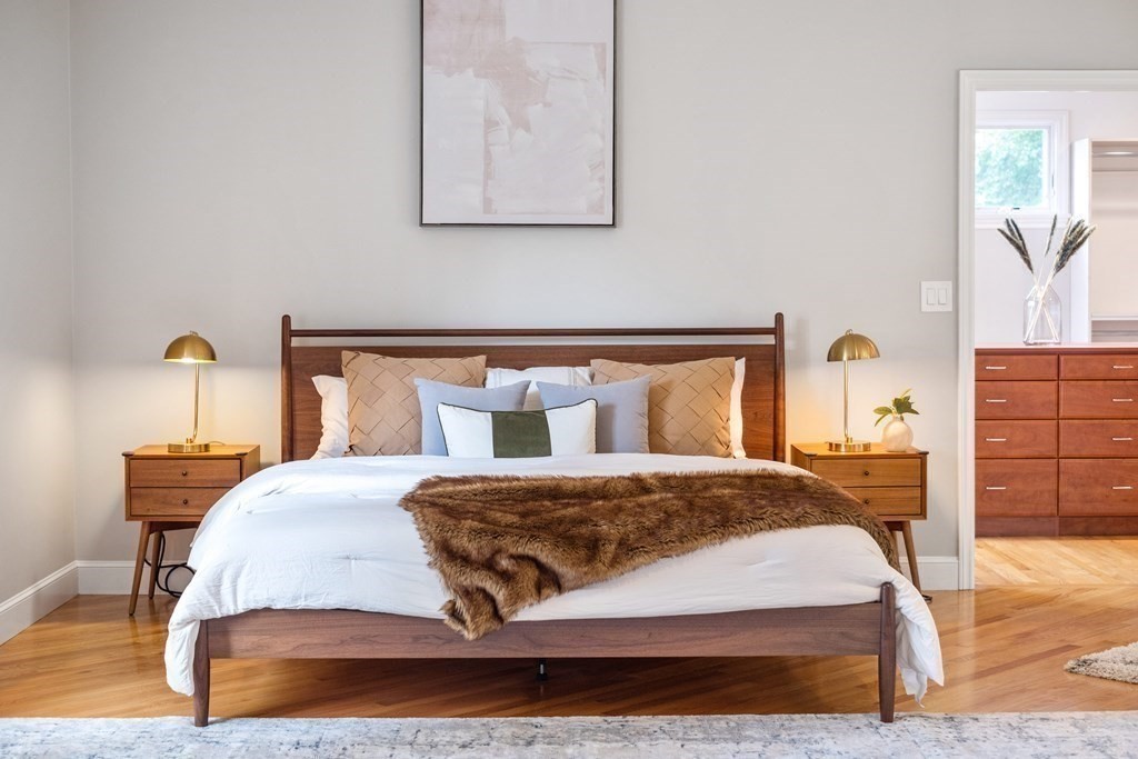 16 Marshall Road Winchester, MA 01890 - Photo 20 of 42 a bedroom with a bed and wooden floor