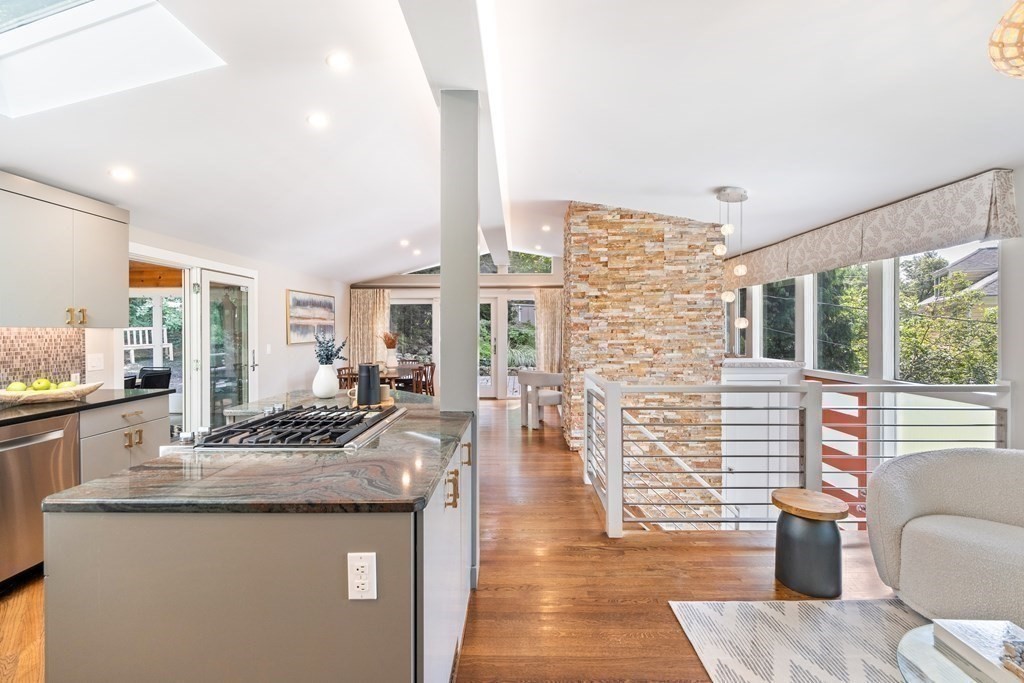 16 Marshall Road Winchester, MA 01890 - Photo 2 of 42 a open kitchen with granite countertop a sink dishwasher stove and wooden cabinets