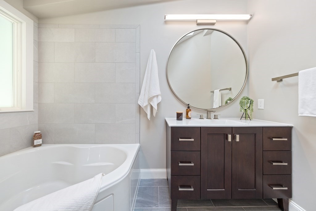 16 Marshall Road Winchester, MA 01890 - Photo 22 of 42 a bathroom with a sink and a mirror