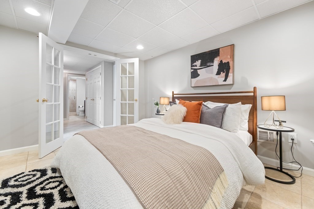 16 Marshall Road Winchester, MA 01890 - Photo 28 of 42 a bedroom with bed and night stand