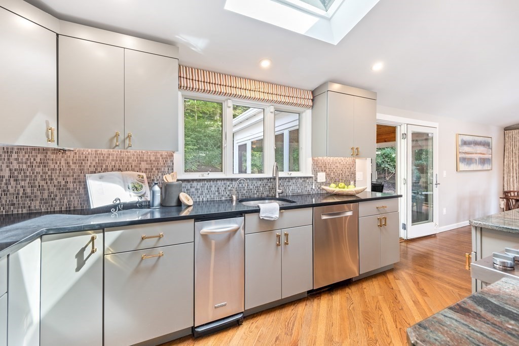 16 Marshall Road Winchester, MA 01890 - Photo 3 of 42 a kitchen with granite countertop white cabinets and a large window