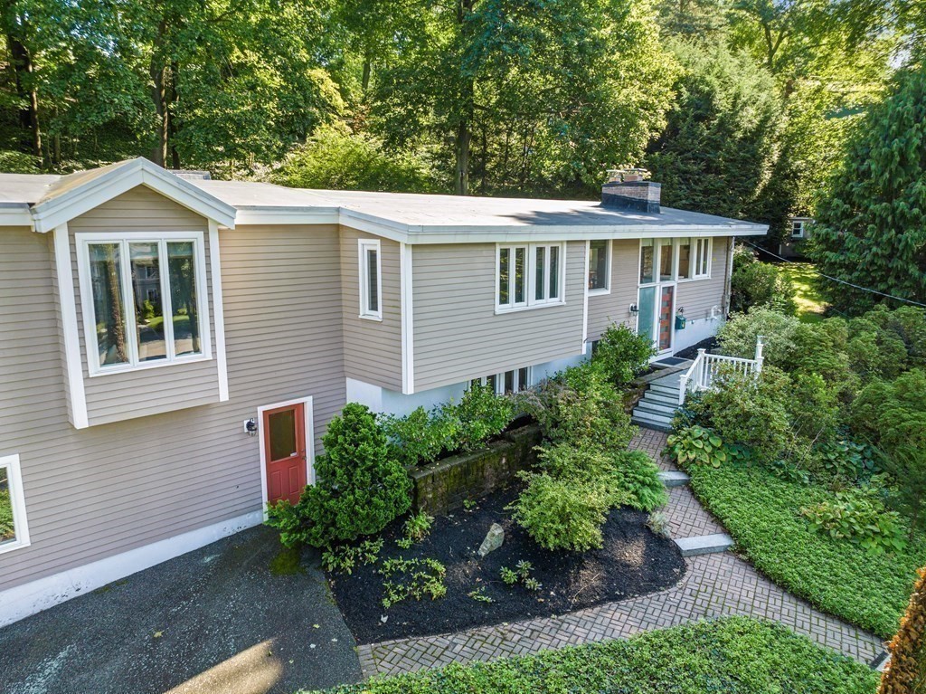 16 Marshall Road Winchester, MA 01890 - Photo 32 of 42 a house that has a lot of plants in it