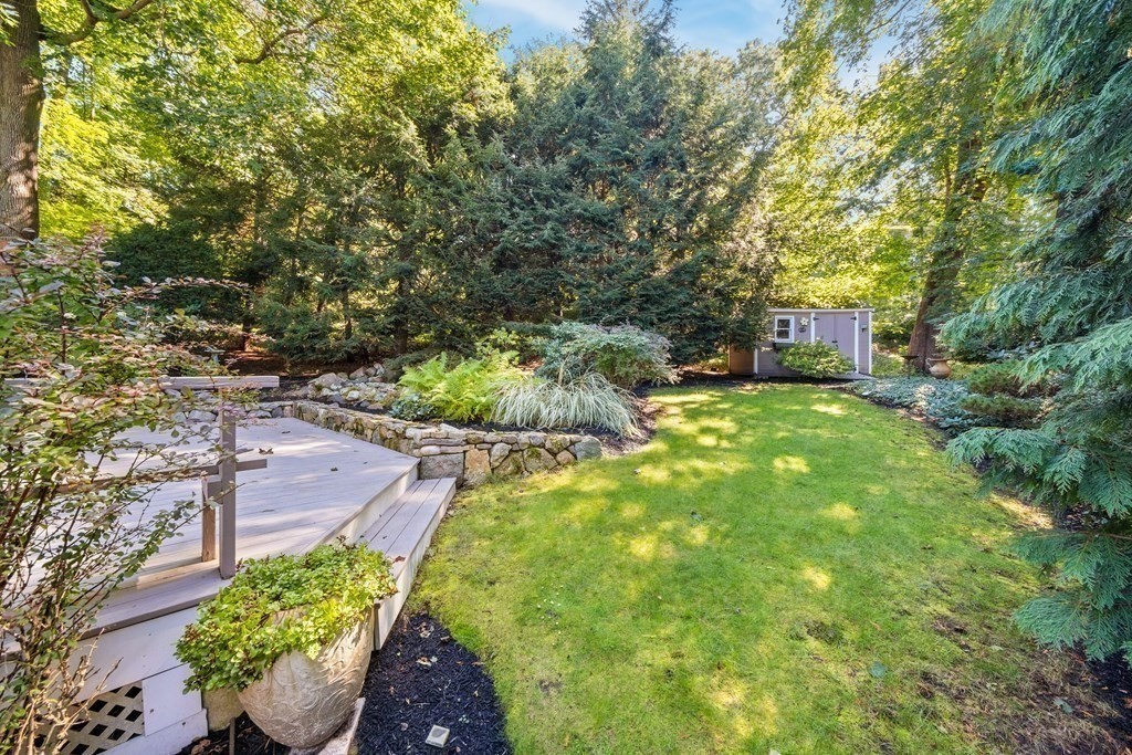 16 Marshall Road Winchester, MA 01890 - Photo 33 of 42 a view of a patio with table and chairs and potted plants