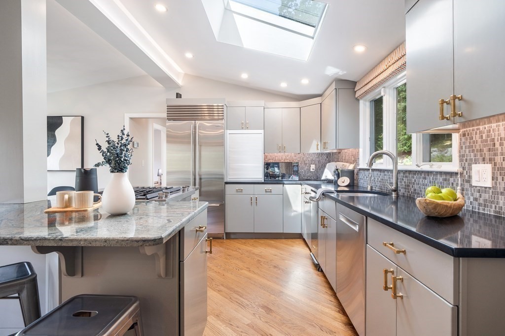 16 Marshall Road Winchester, MA 01890 - Photo 5 of 42 a kitchen with stainless steel appliances a sink stove and cabinets
