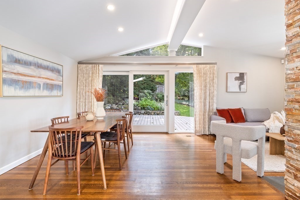 16 Marshall Road Winchester, MA 01890 - Photo 7 of 42 a dining room with wooden floor a chandelier a glass table and chairs