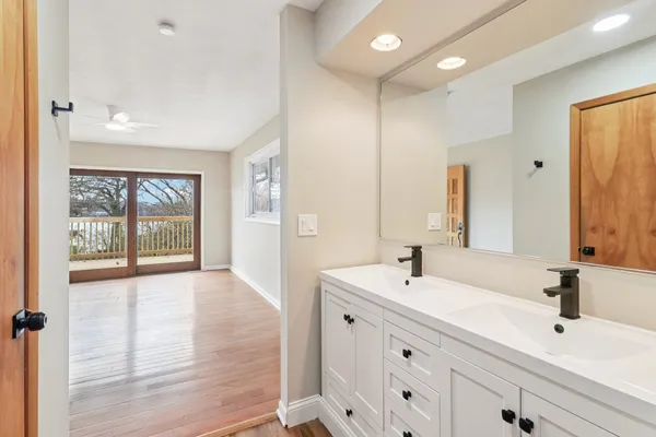 a bathroom with a sink and a mirror