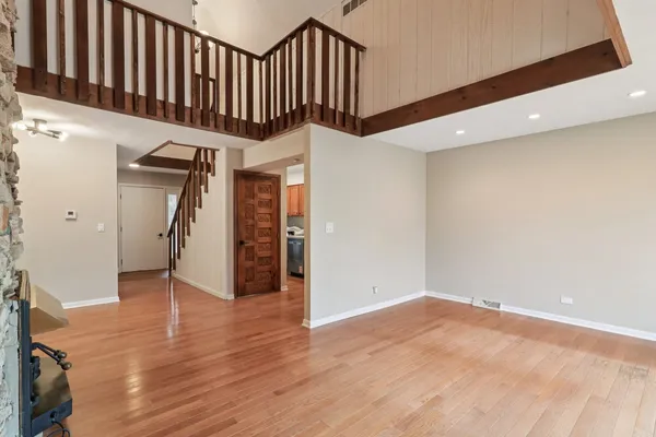 a view of an entryway with wooden floor