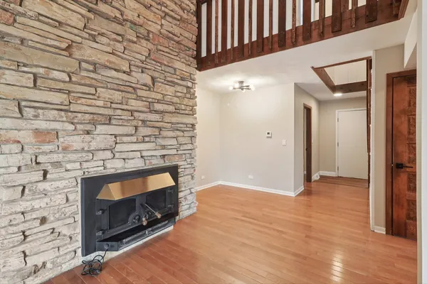 a view of an empty room and wooden floor
