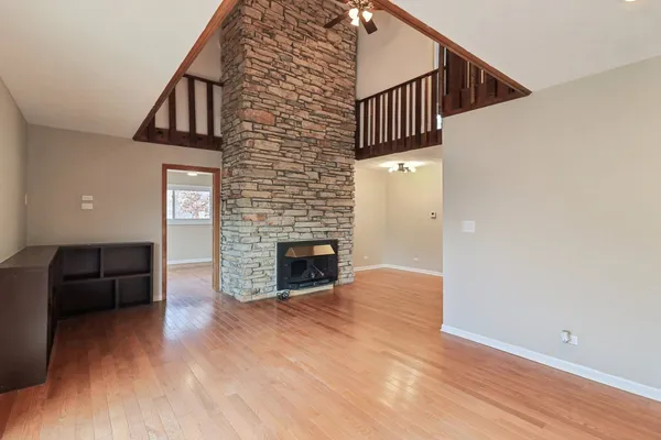 a view of a livingroom with furniture and staircase