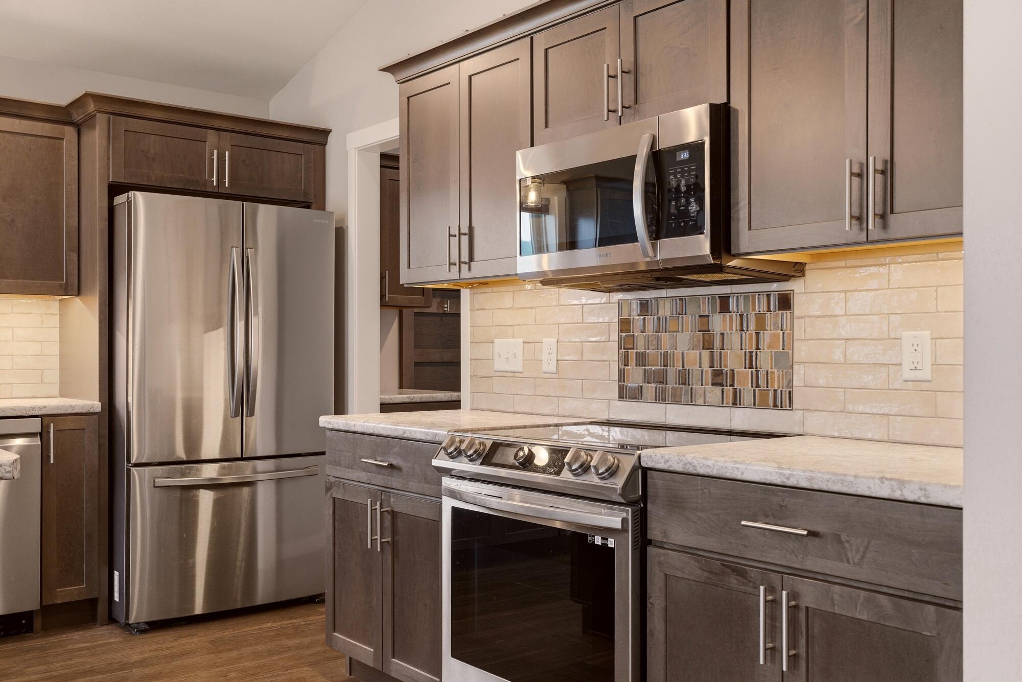 1709 Killdeer Street Holmen, WI 54636 - Photo 8 of 26 Kitchen w/ tile back splash
