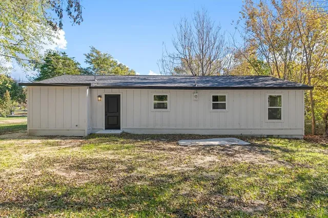 a house with a tree in the background