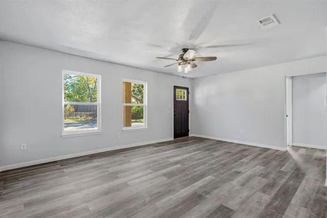 a view of an empty room with a window
