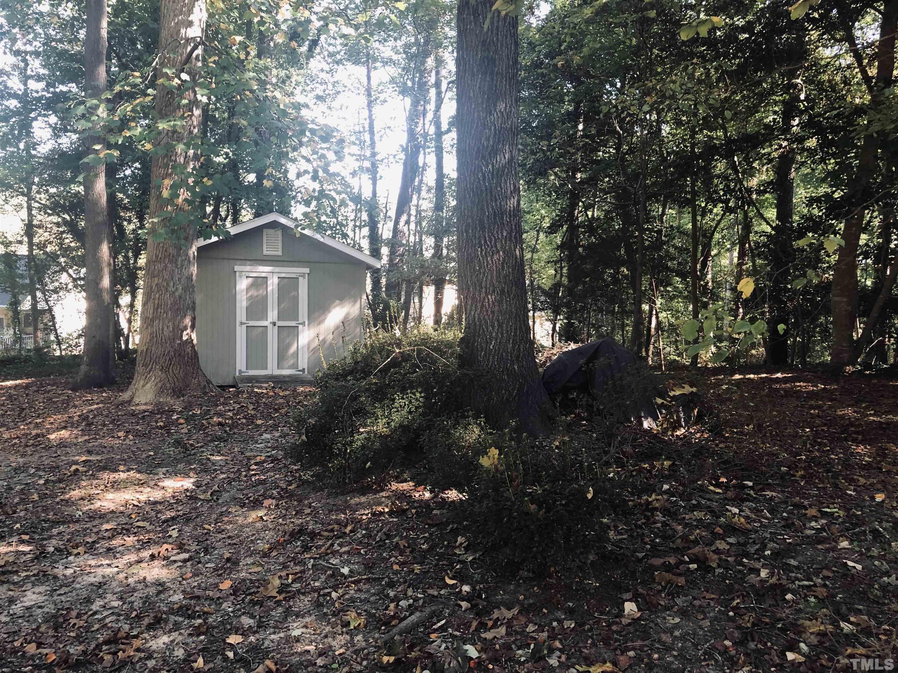 4909 Will-O-Dean Road Raleigh, NC 27616 - Photo 1 of 15 a view of a house with a tree in the background