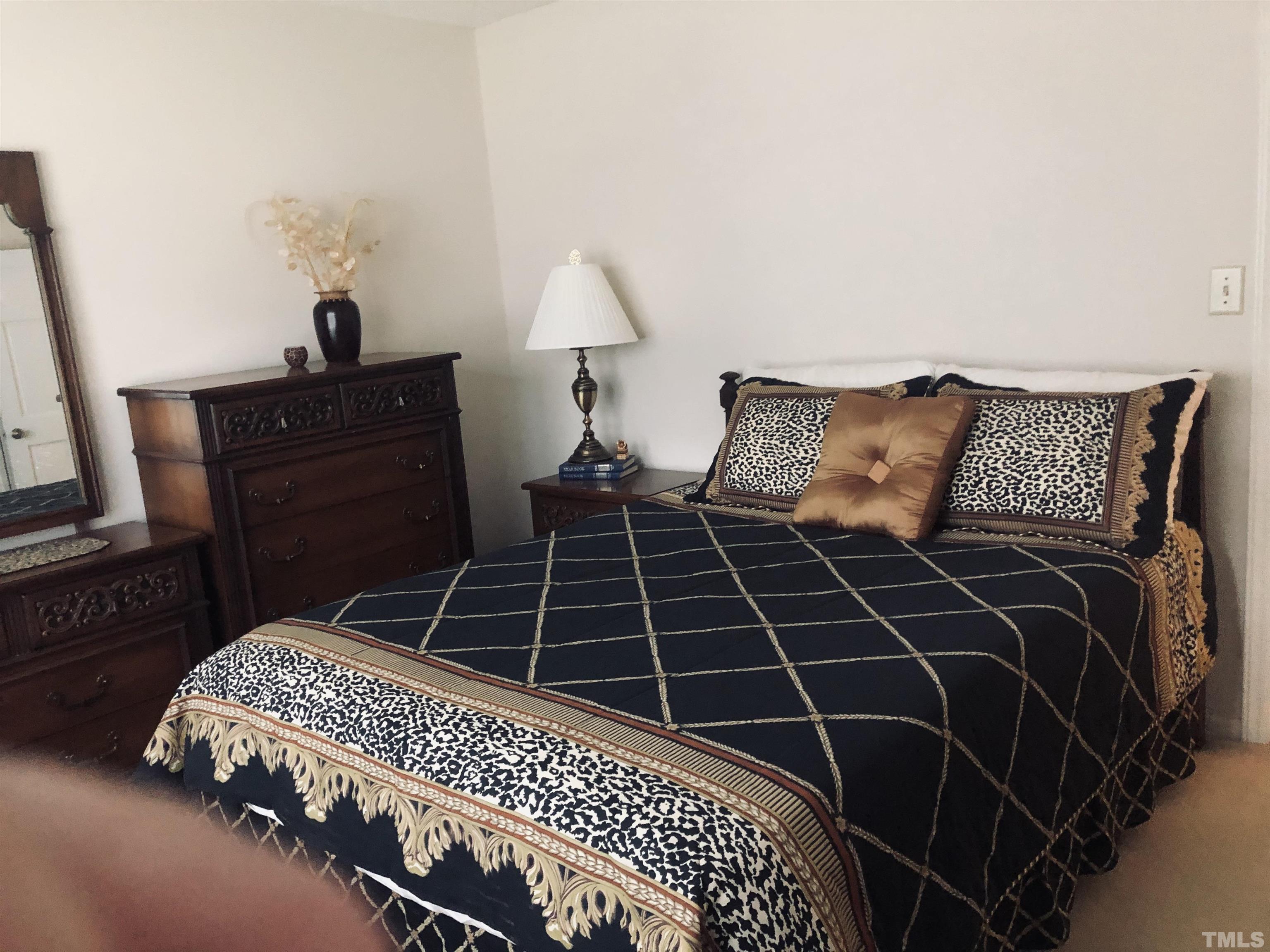 4909 Will-O-Dean Road Raleigh, NC 27616 - Photo 11 of 15 a bedroom with a bed and a dresser