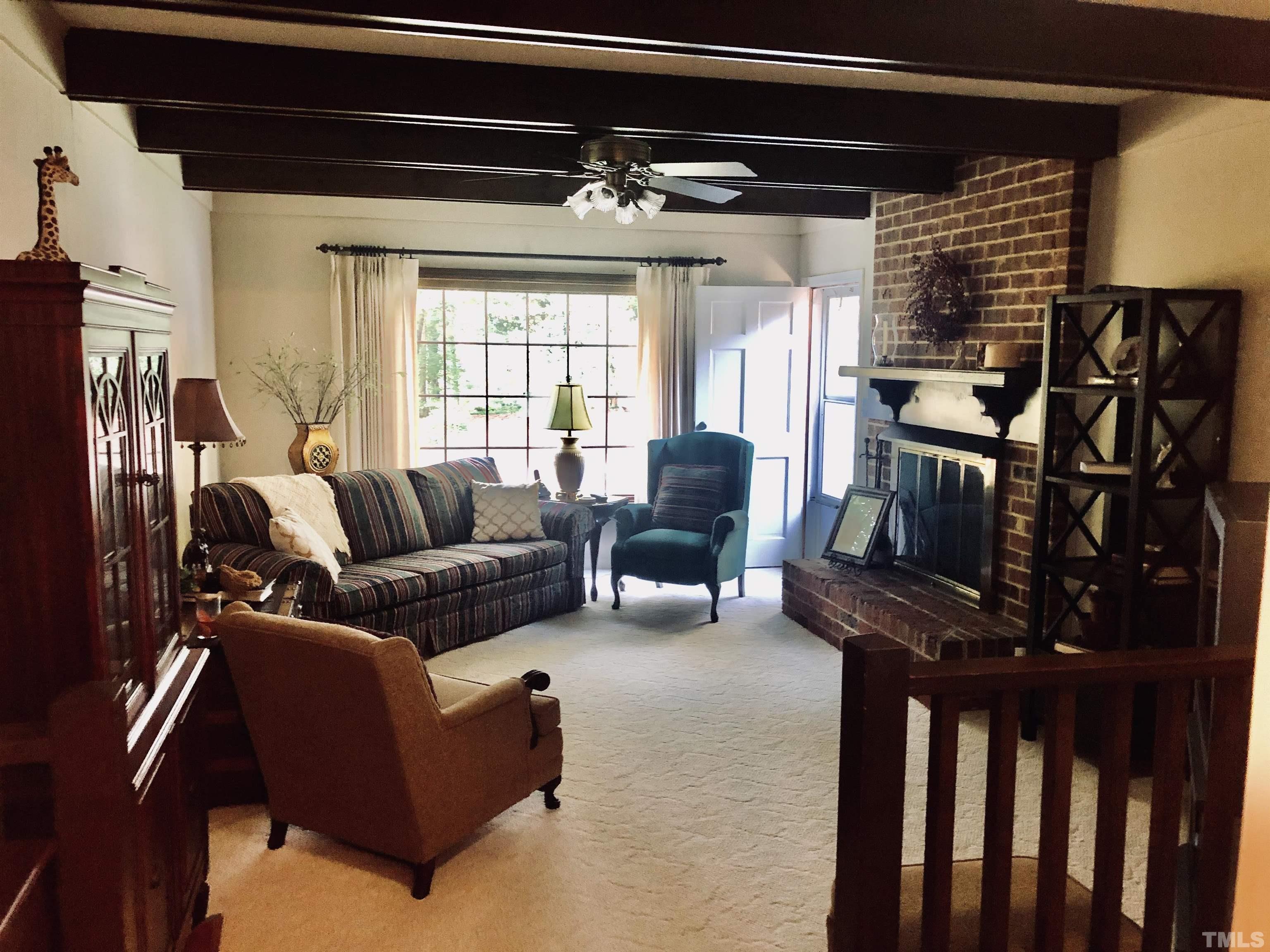 4909 Will-O-Dean Road Raleigh, NC 27616 - Photo 6 of 15 a living room with furniture and a flat screen tv
