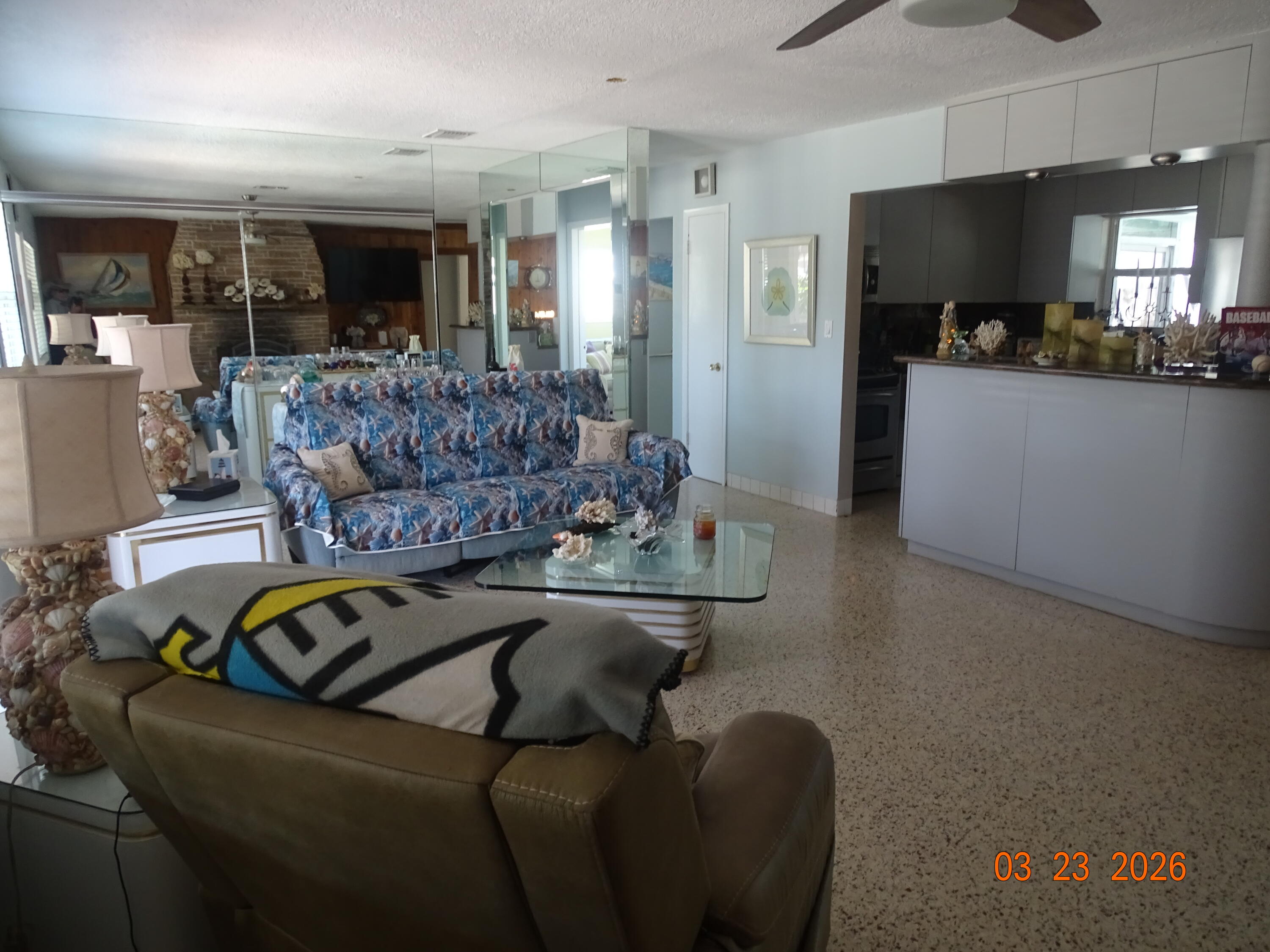 4760 Northwest 2nd Terrace Boca Raton, FL 33431 - Photo 12 of 25 a living room with furniture and a flat screen tv
