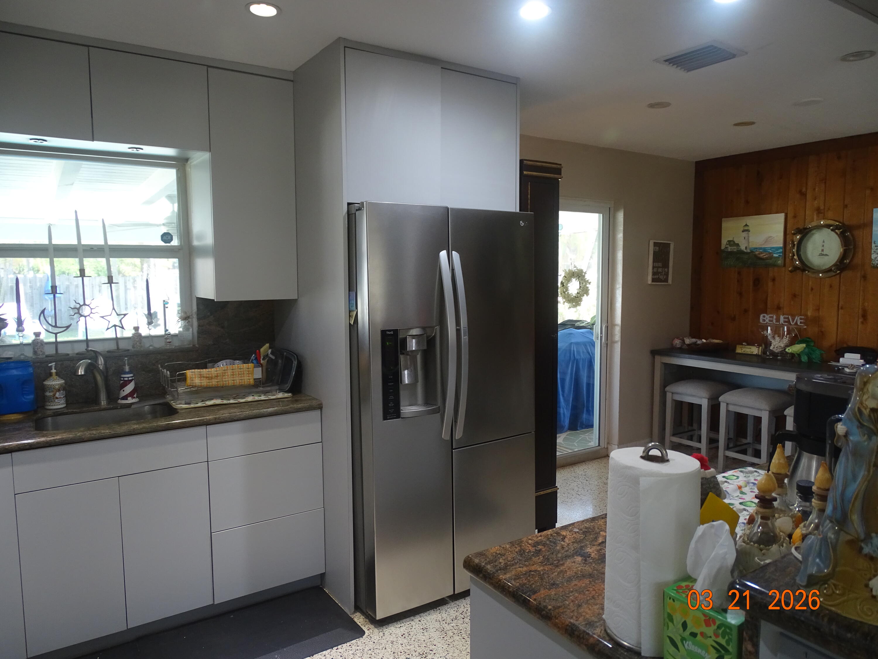 4760 Northwest 2nd Terrace Boca Raton, FL 33431 - Photo 14 of 25 a kitchen with stainless steel appliances granite countertop a refrigerator and a stove