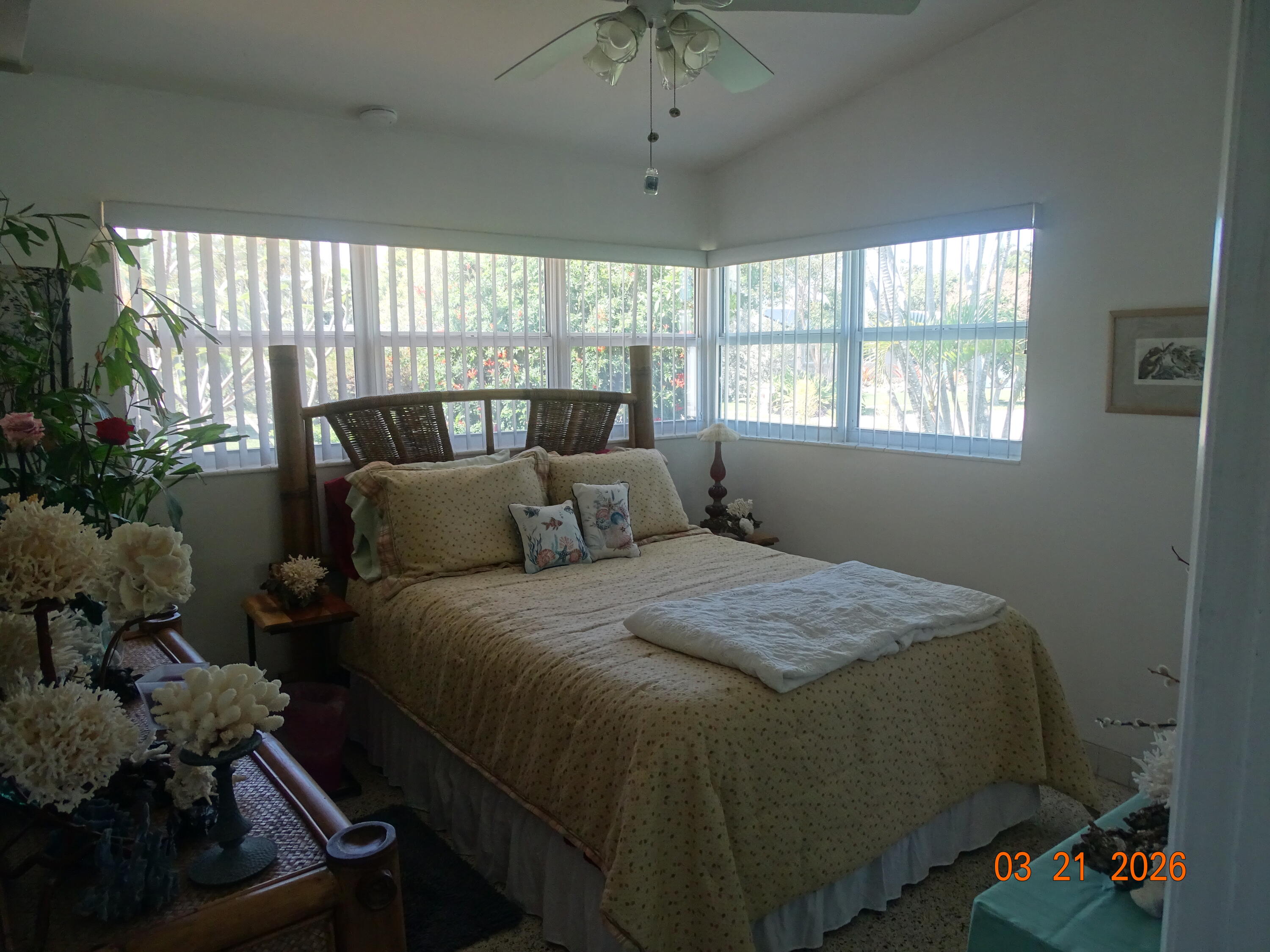 4760 Northwest 2nd Terrace Boca Raton, FL 33431 - Photo 15 of 25 a bed sitting in a bedroom next to a window