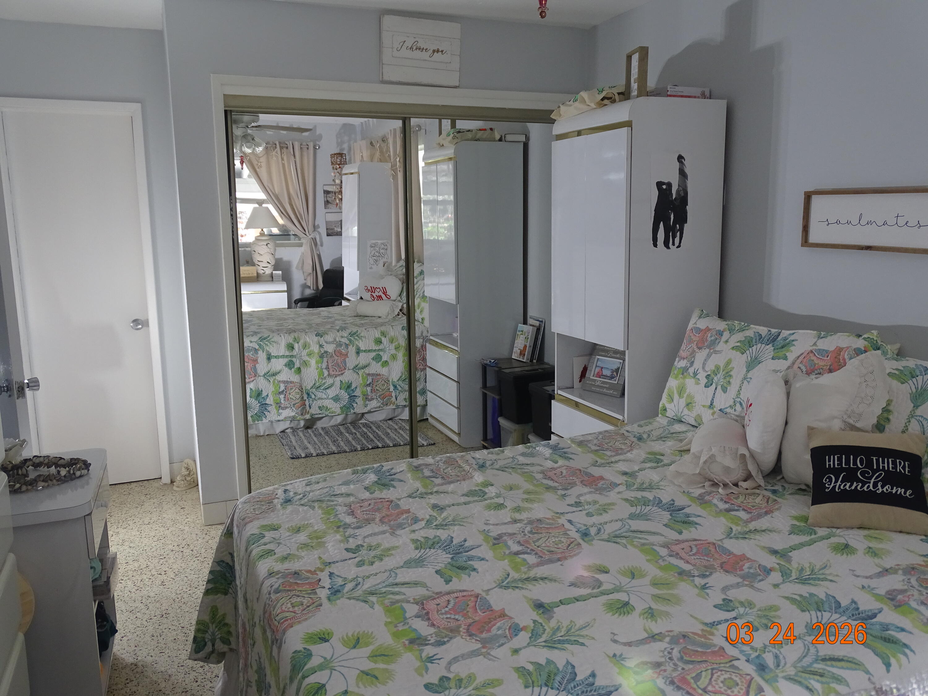 4760 Northwest 2nd Terrace Boca Raton, FL 33431 - Photo 20 of 25 a spacious bedroom with a bed and a television