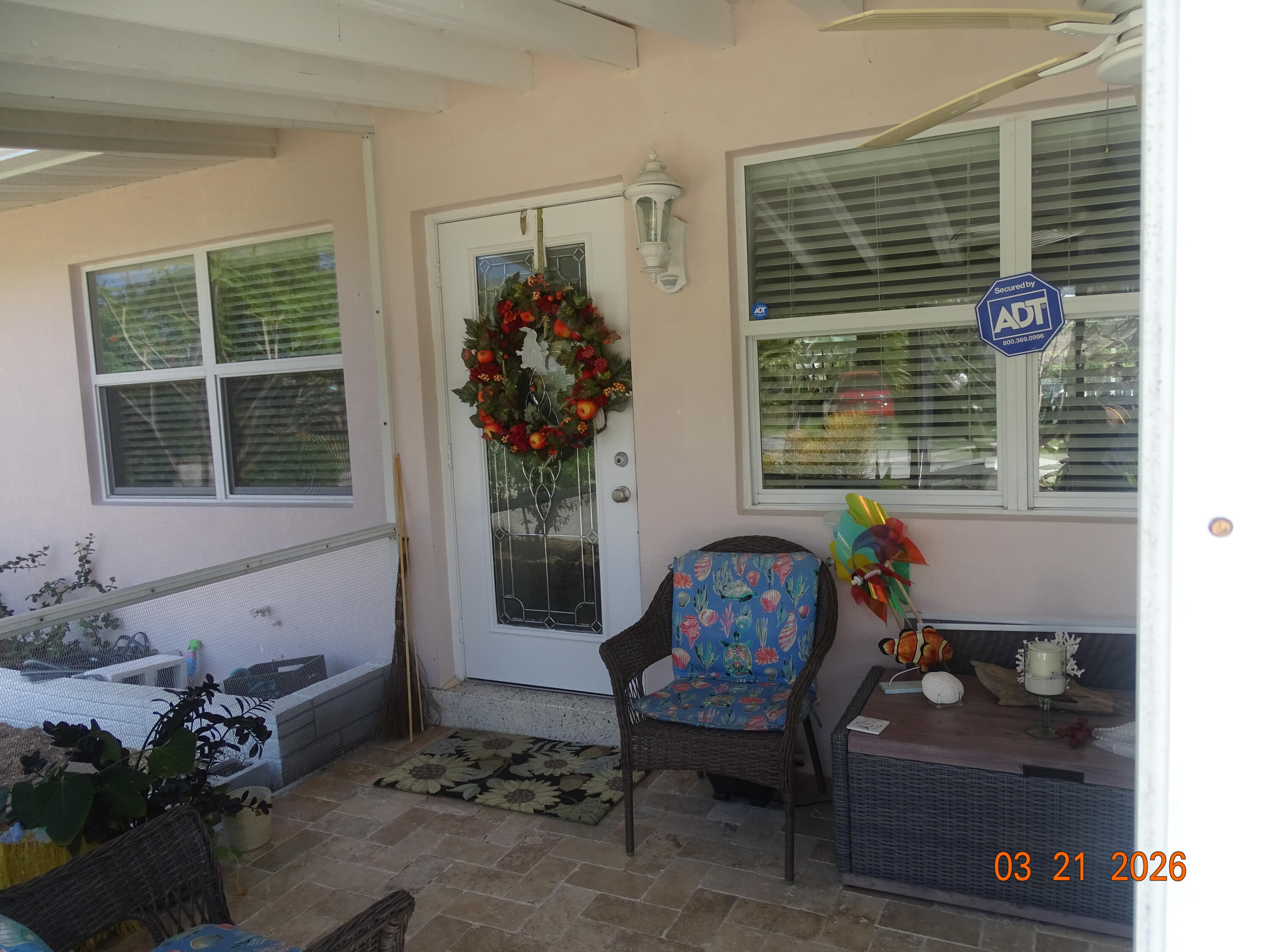 4760 Northwest 2nd Terrace Boca Raton, FL 33431 - Photo 8 of 25 a front view of a house with outdoor seating