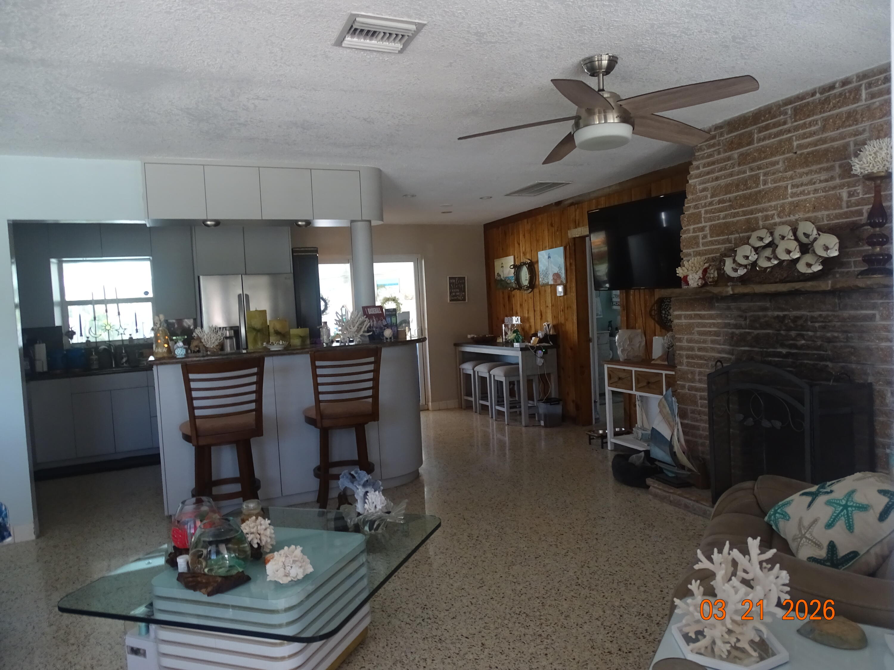 4760 Northwest 2nd Terrace Boca Raton, FL 33431 - Photo 10 of 25 a living room with furniture and a fireplace