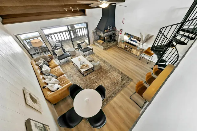 a view of living room with furniture and a rug