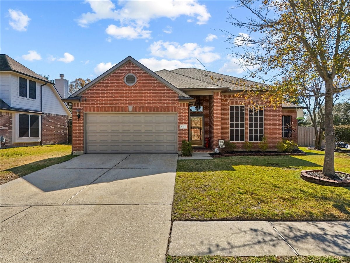 8102 Pinewood Park Humble, TX 77346 - Photo 2 of 37 a view of a house with swimming pool and sitting area
