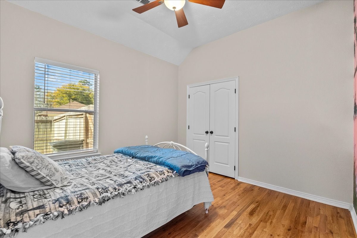 8102 Pinewood Park Humble, TX 77346 - Photo 23 of 37 a bedroom with a bed and a window