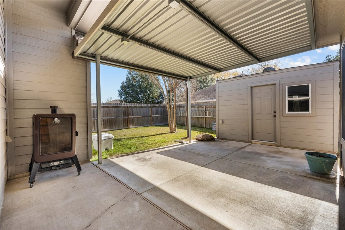 8102 Pinewood Park Humble, TX 77346 - Photo 28 of 37 a view of backyard with a patio