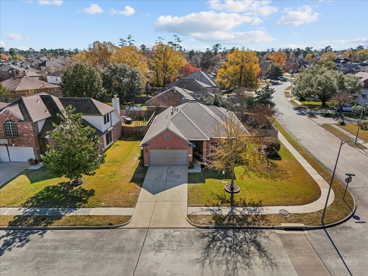 8102 Pinewood Park Humble, TX 77346 - Photo 3 of 37 a view of a swimming pool with a yard