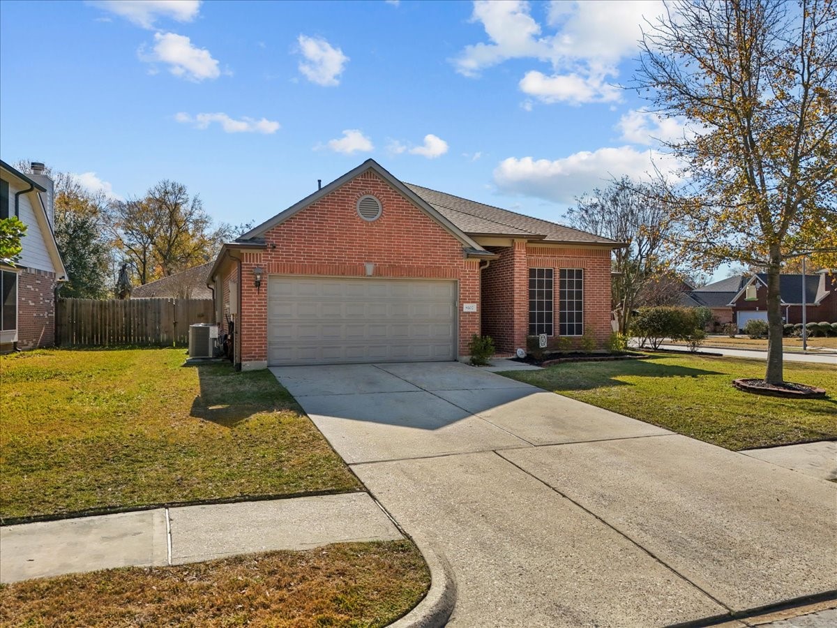8102 Pinewood Park Humble, TX 77346 - Photo 32 of 37 a front view of a house with garden