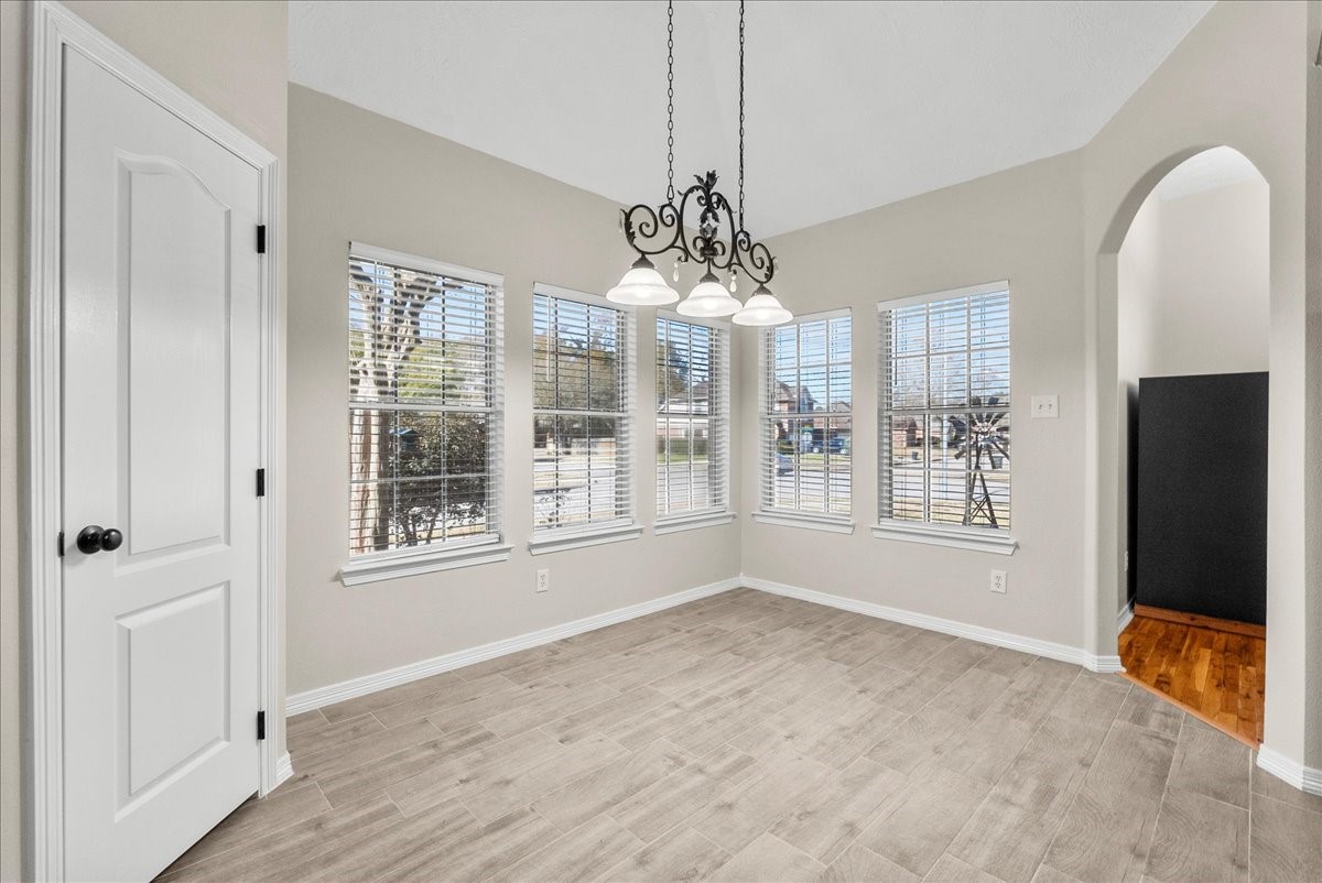 8102 Pinewood Park Humble, TX 77346 - Photo 8 of 37 a view of an empty room with a window
