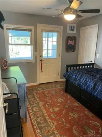 a bedroom with a bed and window