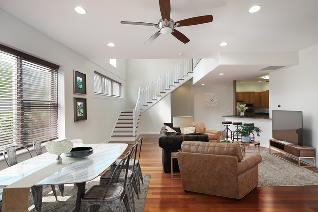 4 Rienzi Lane Highwood, IL 60040 - Photo 2 of 10 a living room with furniture kitchen view and a wooden floor