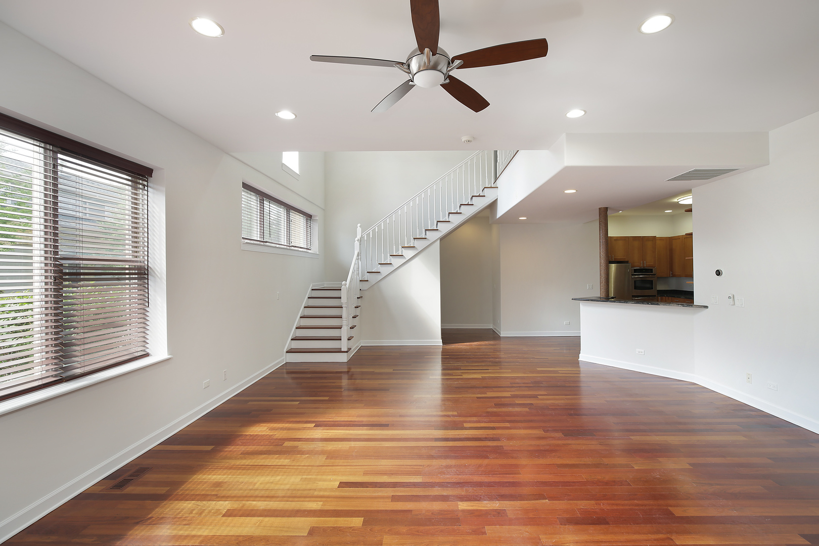 4 Rienzi Lane Highwood, IL 60040 - Photo 3 of 10 a view of an empty room with wooden floor and a window