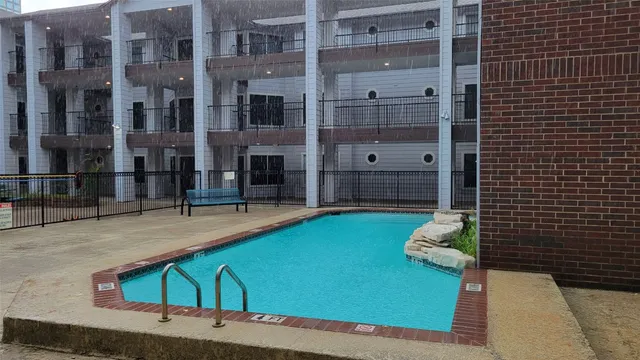 a view of a balcony with yard