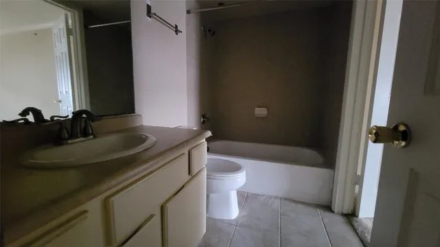 a bathroom with a sink a toilet and bathtub