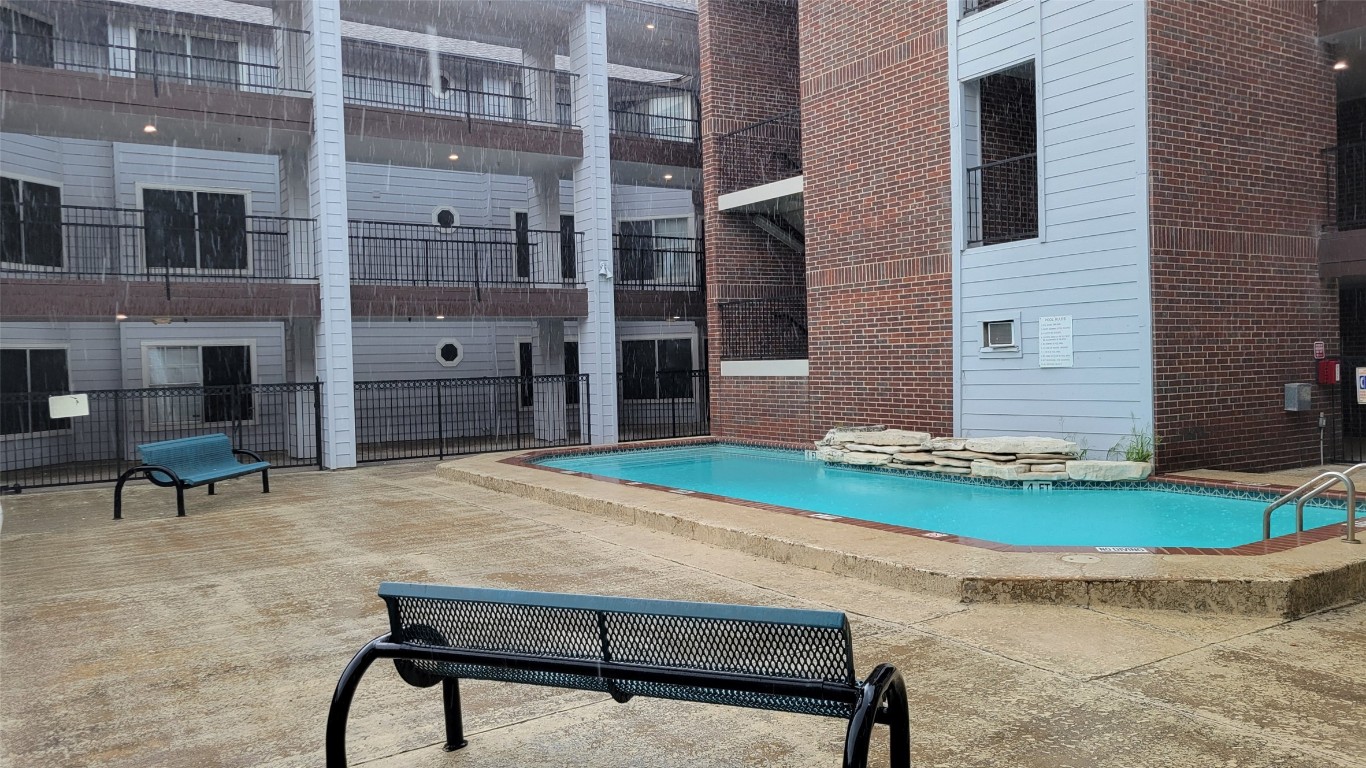 501 West 26th Street, Unit 120 Austin, TX 78705 - Photo 10 of 10 a wooden bench sitting in front of a building