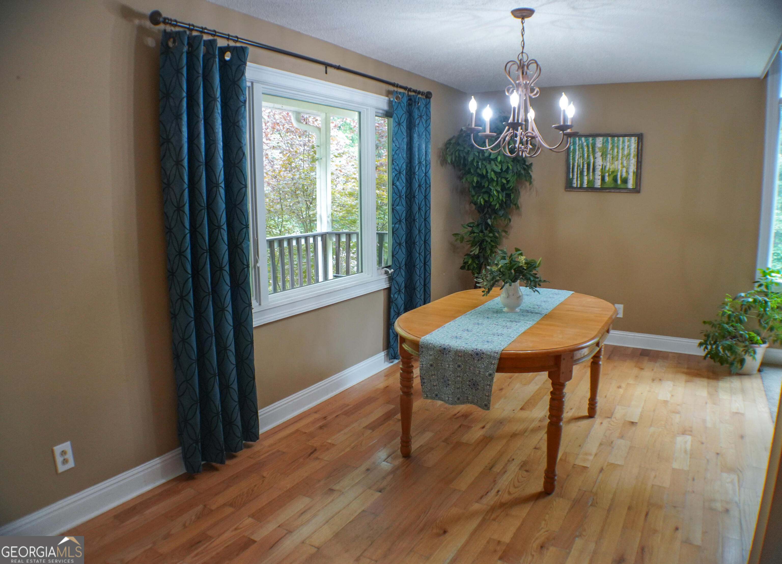 335 Winding Stream Trail Hampton, GA 30228 - Photo 4 of 35 a view of a room with furniture window and wooden floor