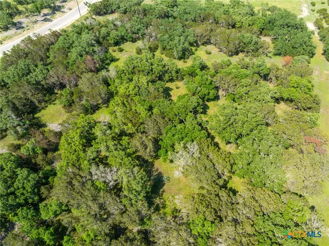 a view of a field with an outdoor space