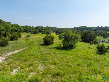 a view of a yard with an outdoor space