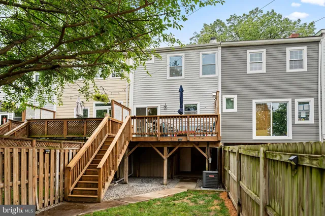 a view of a porch with wooden floor and fence