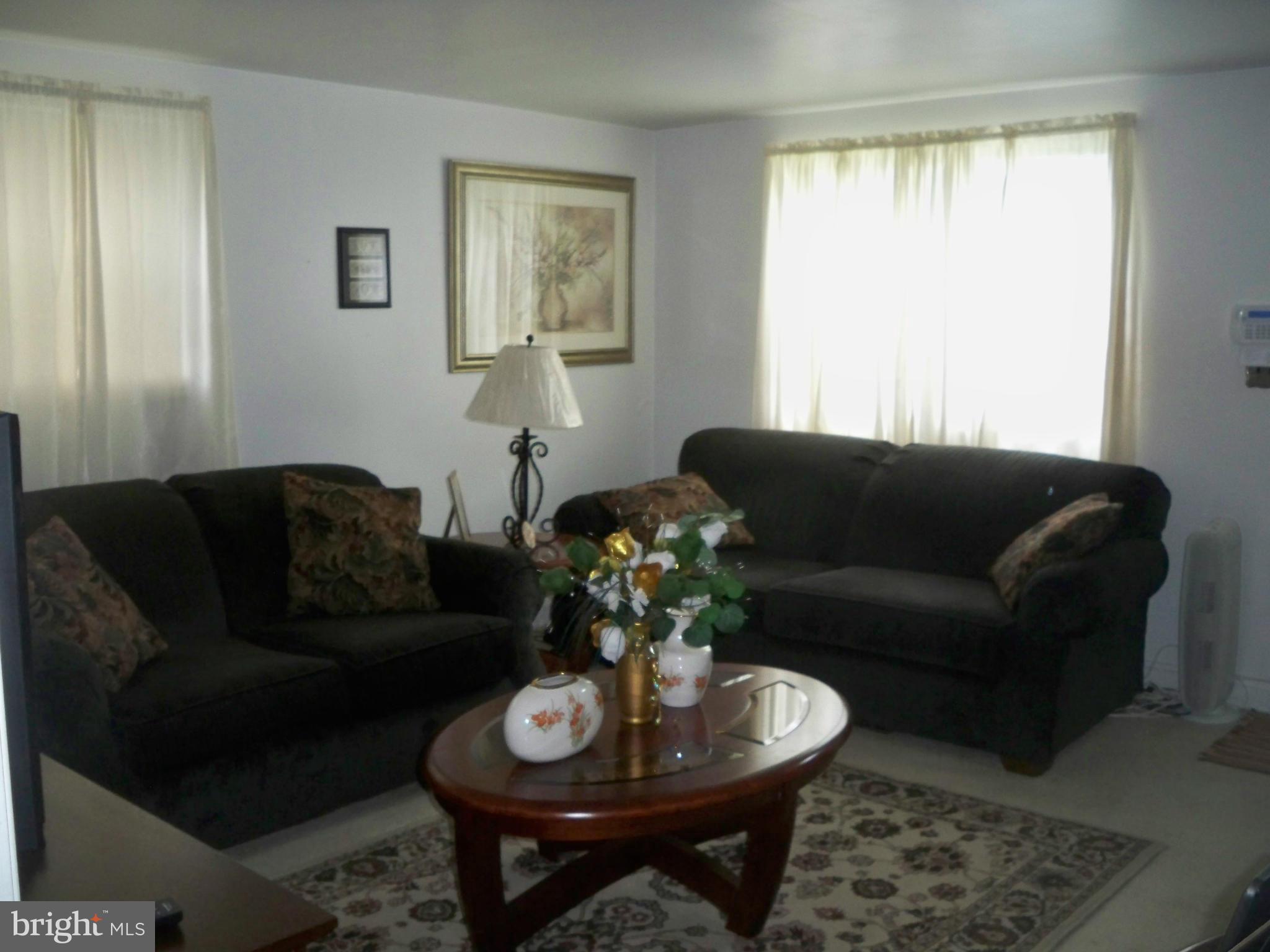 1338 Halstead Road Baltimore, MD 21234 - Photo 11 of 22 a living room with furniture a table and a window