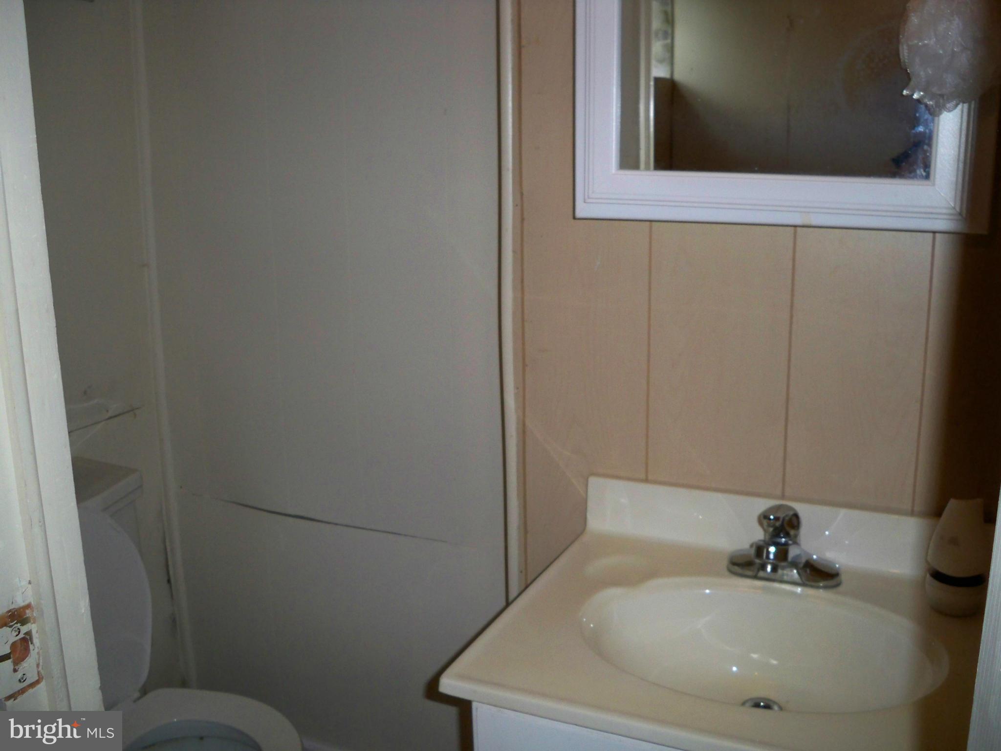 1338 Halstead Road Baltimore, MD 21234 - Photo 22 of 22 a bathroom with a sink and a toilet