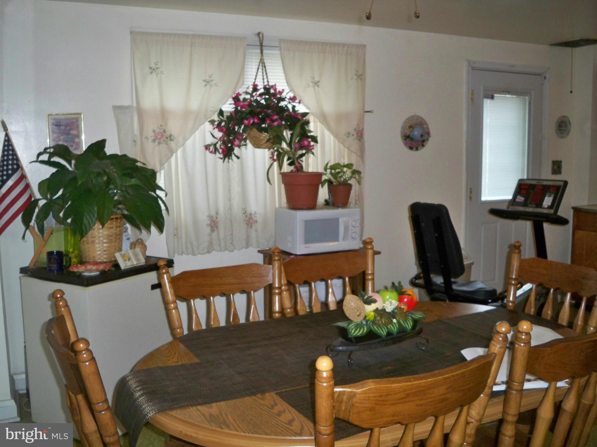 1338 Halstead Road Baltimore, MD 21234 - Photo 7 of 22 a view of a dining room with furniture and wooden floor