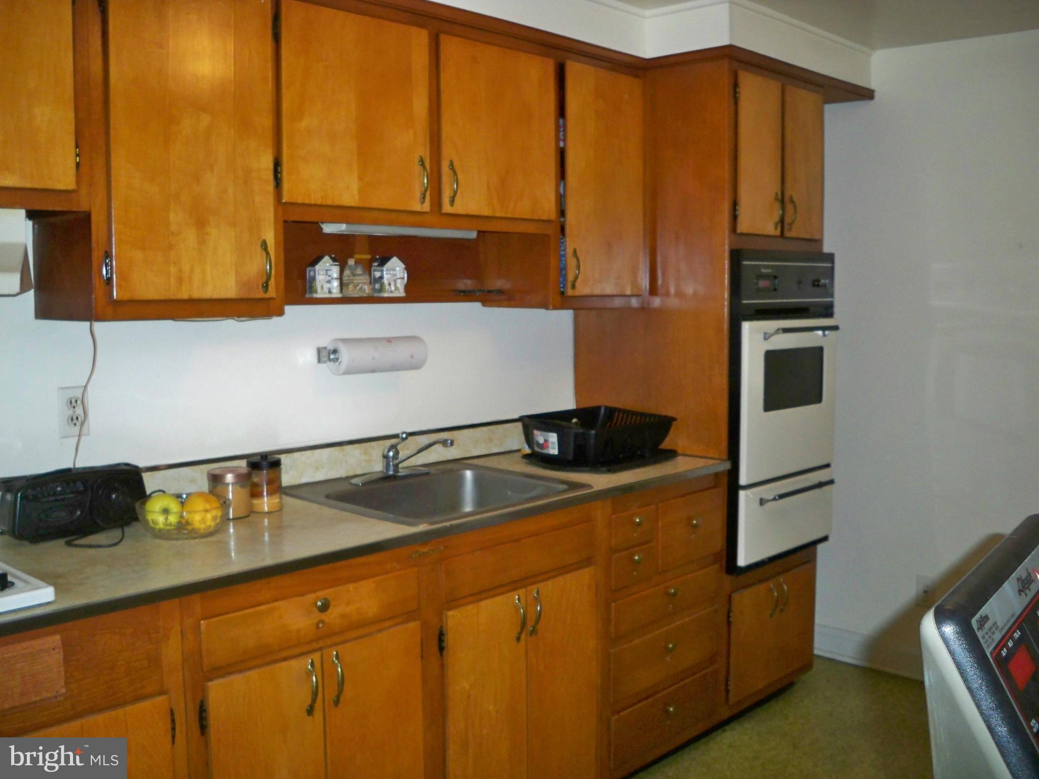 1338 Halstead Road Baltimore, MD 21234 - Photo 9 of 22 a kitchen with stainless steel appliances granite countertop a sink and a refrigerator