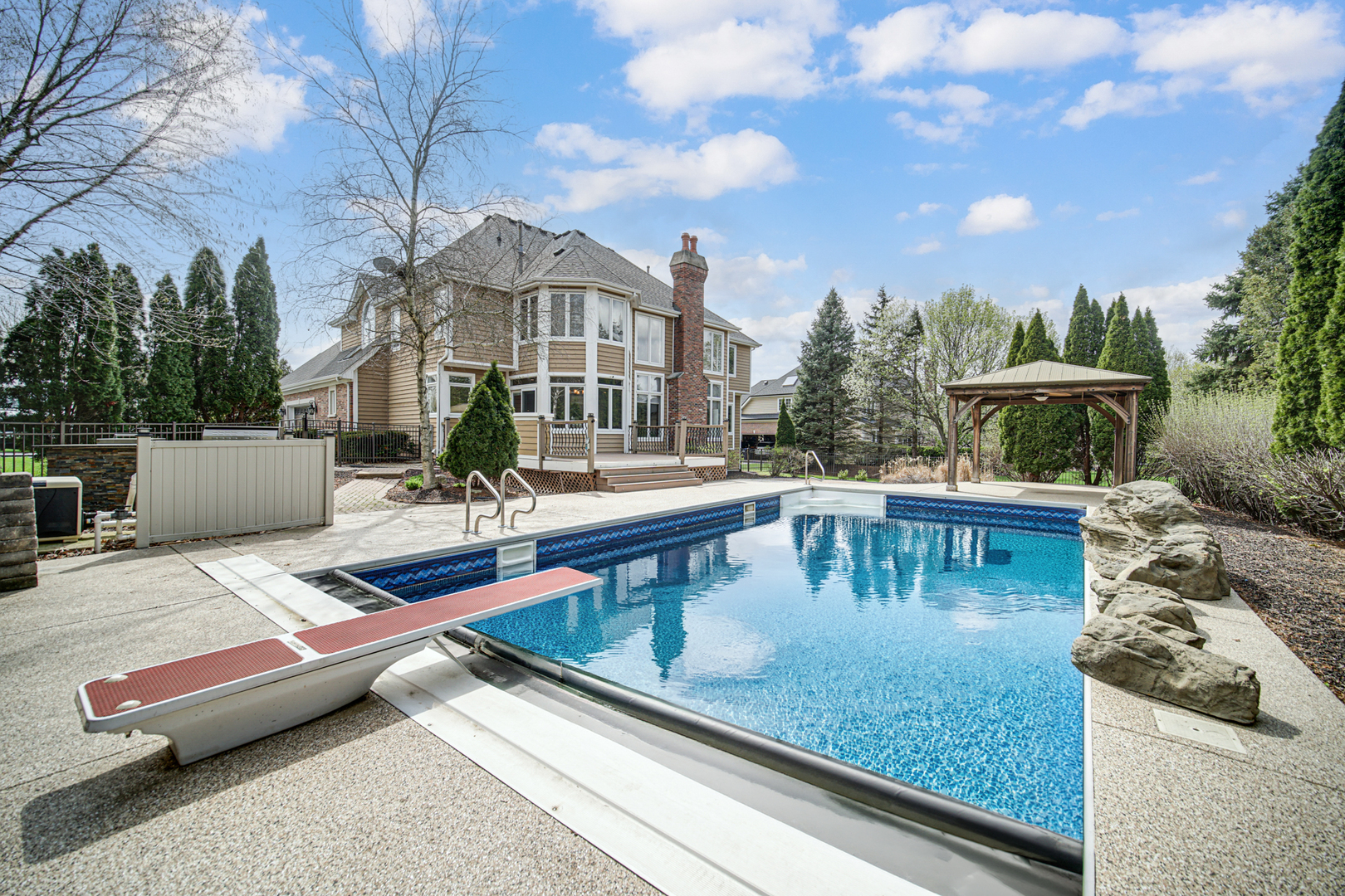 3N777 Walt Whitman Road St. Charles, IL 60175 - Photo 2 of 29 a view of a patio with couches chairs and a table
