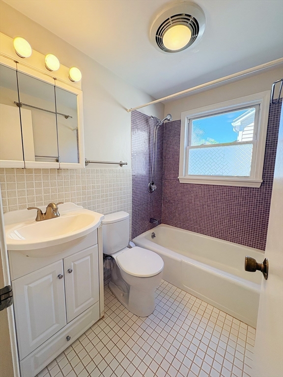 55 Sutherland Road, Unit 55 Arlington, MA 02476 - Photo 21 of 23 a bathroom with a sink a toilet and shower
