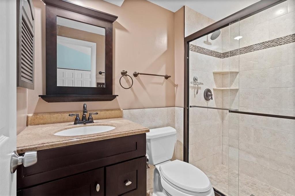 102 Bertley Ridge Drive Coraopolis, PA 15108 - Photo 15 of 24 a bathroom with a sink vanity mirror and toilet